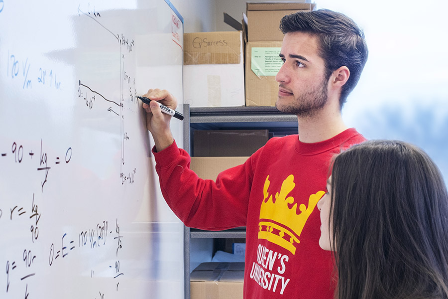 students looking at whiteboard